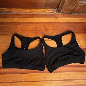 Two black Athleta sports bras